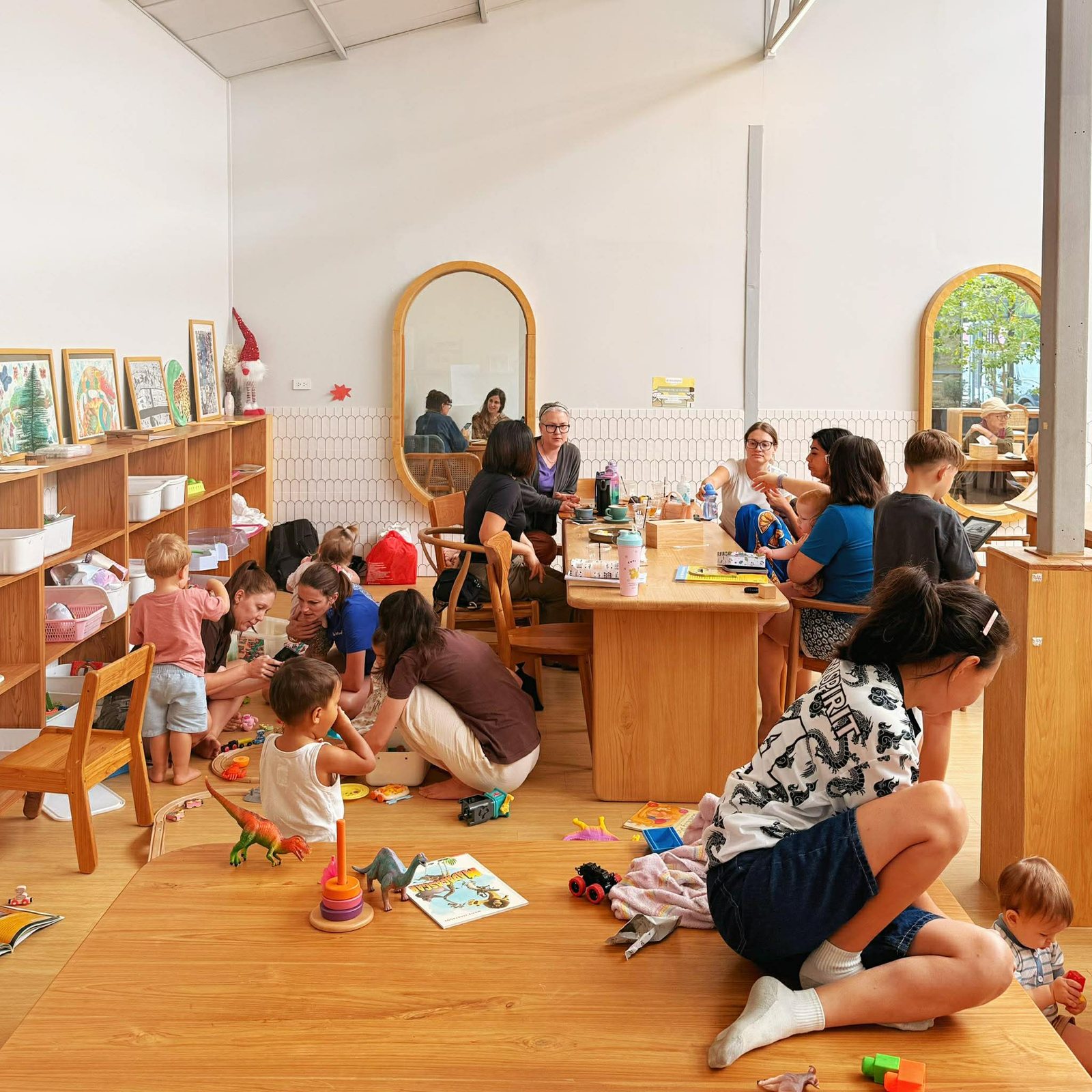 Families and children gathering around tables at the café