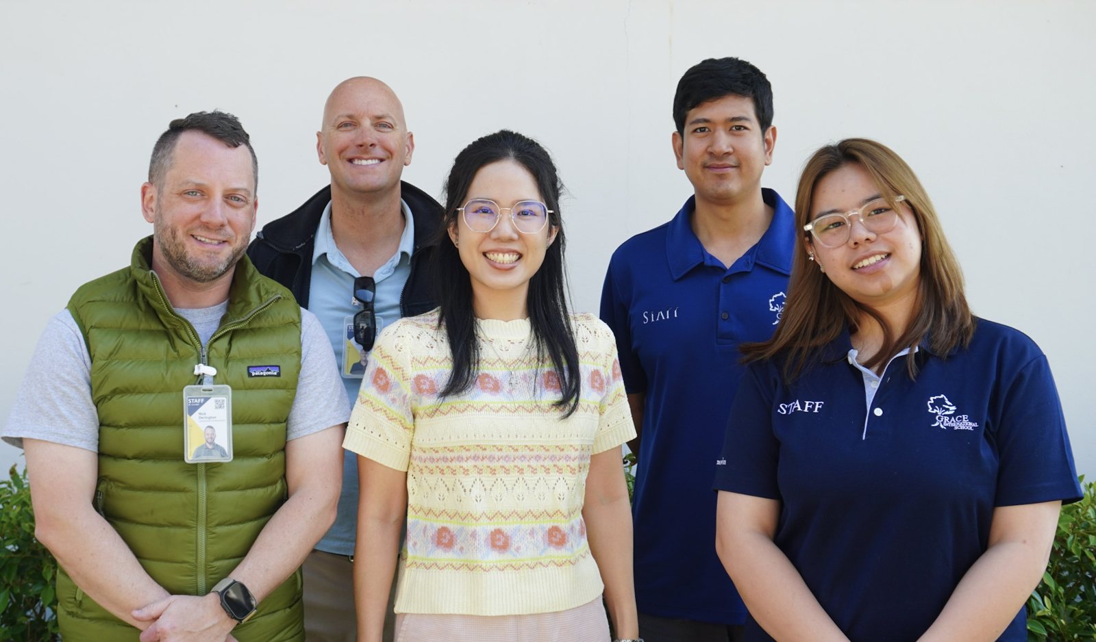 Nick with Grace International School staff and community members